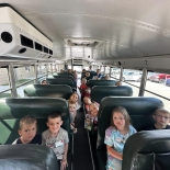 A picture of students sitting inside a school bus